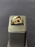 Anillo ondulado de circonitas de oro amarillo/rosa de 14K
