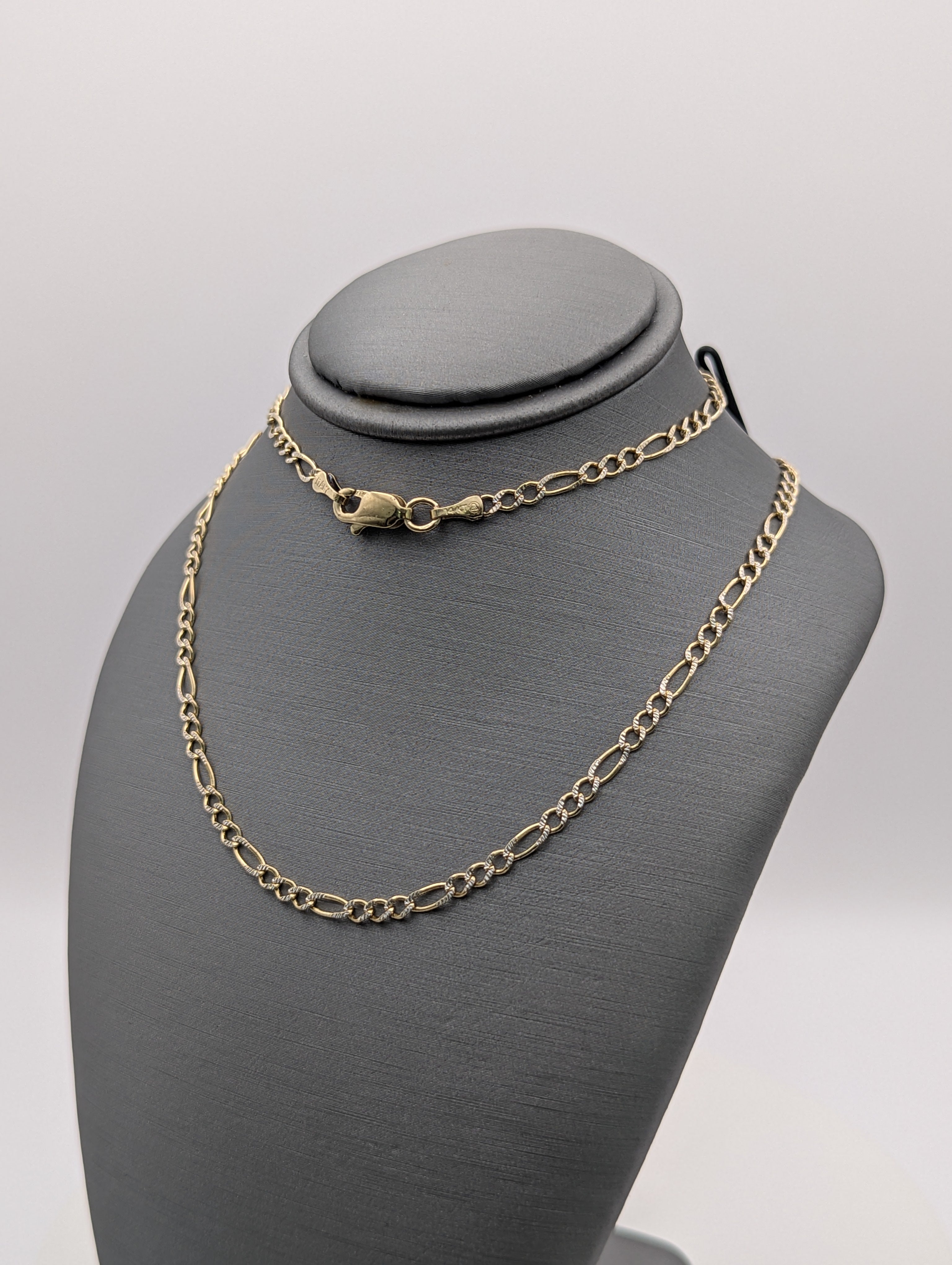 Cadena Fígaro de oro amarillo de 14K con corte de diamante